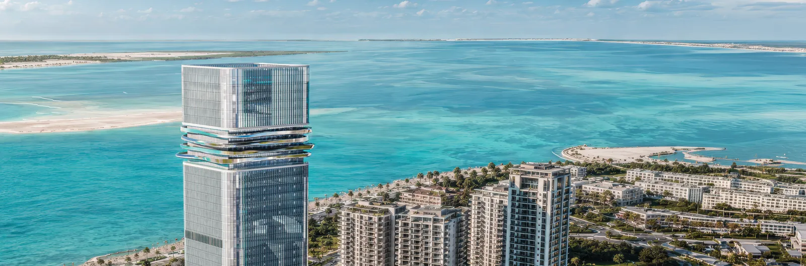 Aerial view of Radiant Legacy on the shore of Al Reem Island, with turquoise shallows and sandbanks beyond