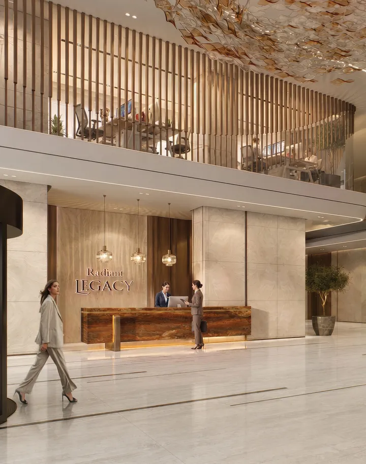 Reception desk in walnut and stone beneath the Radiant Legacy name
